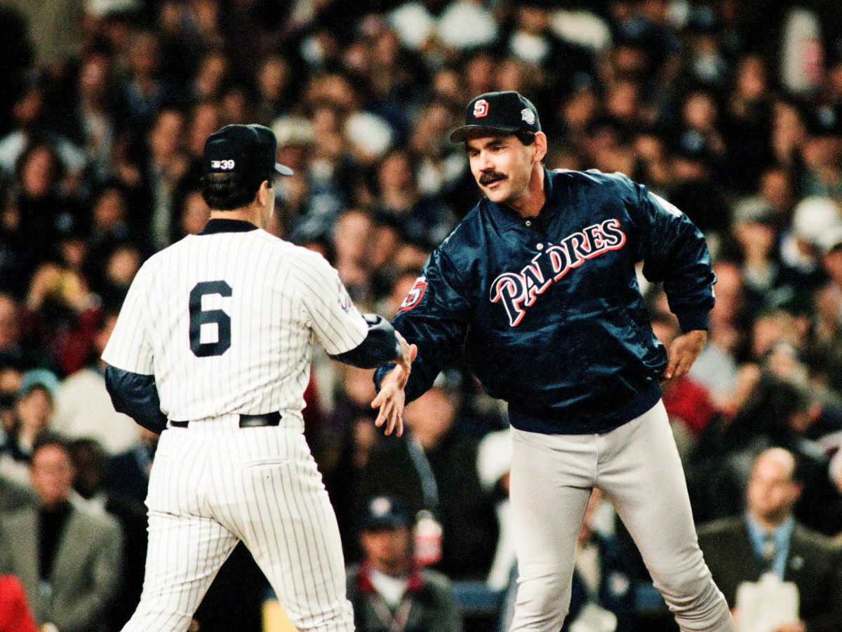 Bruce Bochy of the San Diego Padres shakes hands with Joe Torre of the New York Yankees prior to Game One of the World Series on October 17, 1998 at Yankee Stadium in Bronx, New York. (Photo by Sporting News via Getty Images via Getty Images)