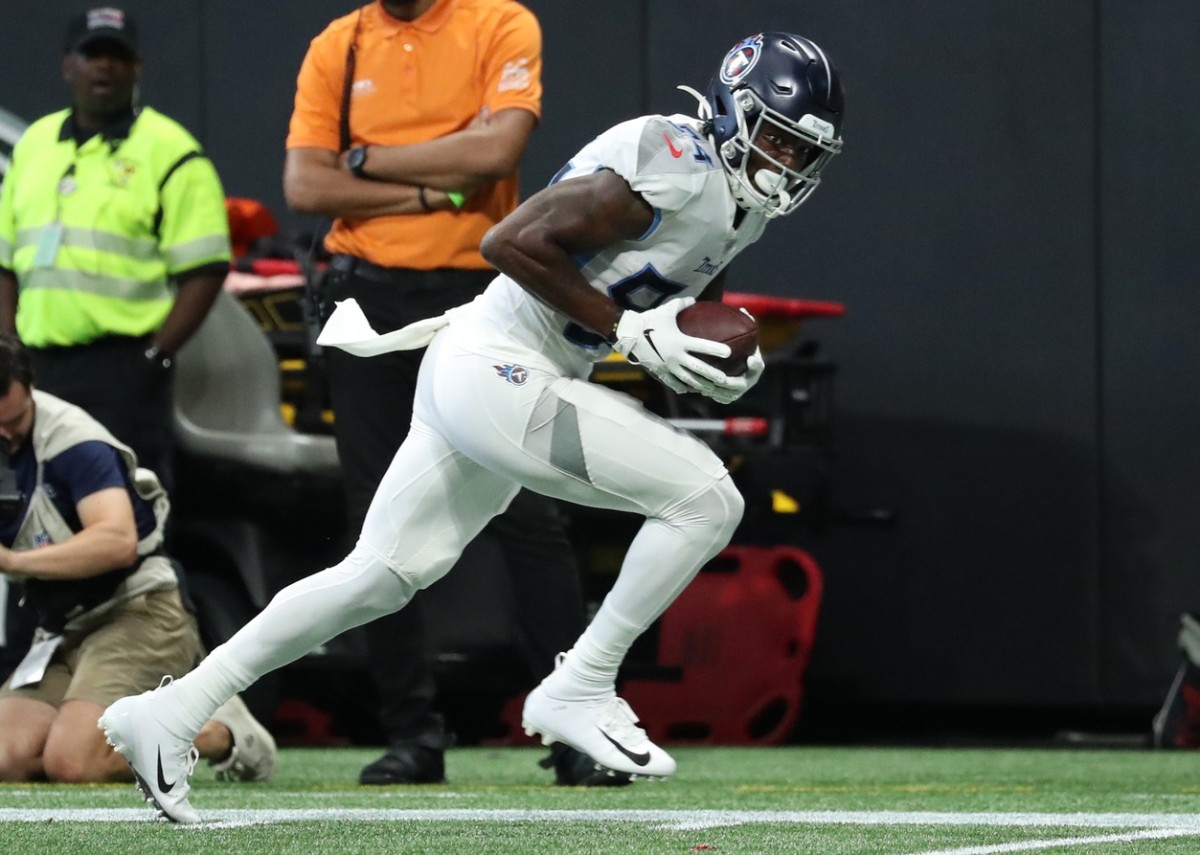 Tennessee Titans wide receiver Corey Davis (84) scores a touchdown in the second quarter against the Atlanta Falcons at Mercedes-Benz Stadium.