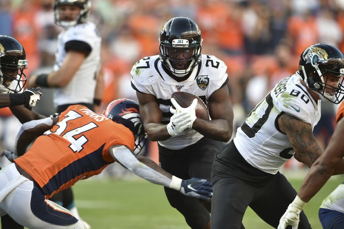 Jacksonville Jaguars running back Leonard Fournette (27) carries for some of his 225 rushing yards at Empower Field at Mile High.