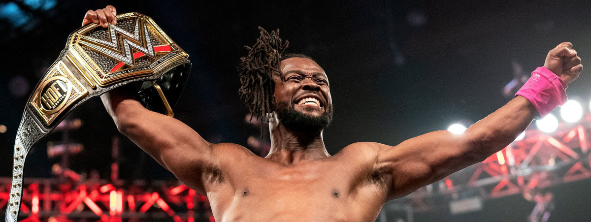 WWE Champion Kofi Kingston celebrates in the ring