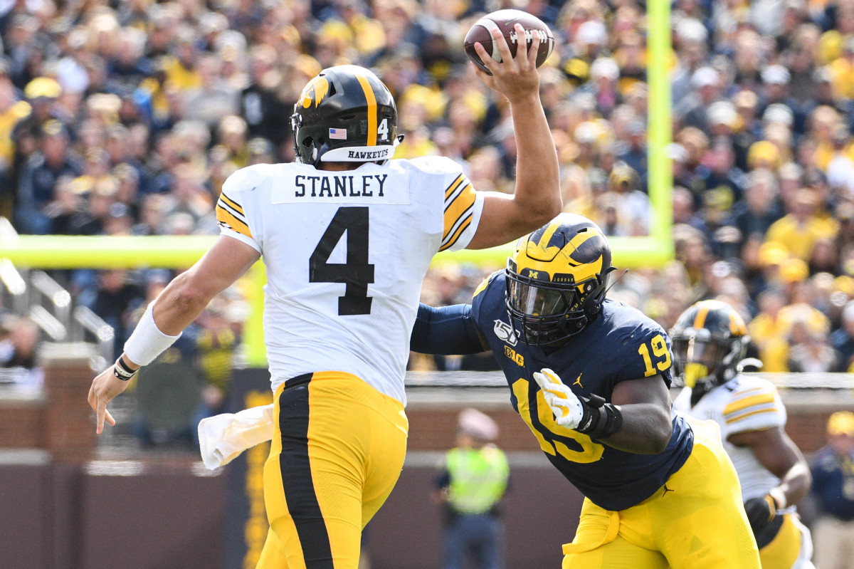 Iowa quarterback Nate Stanley throws the ball as Michigan defensive lineman Kwity Paye pressures in the third quarter.