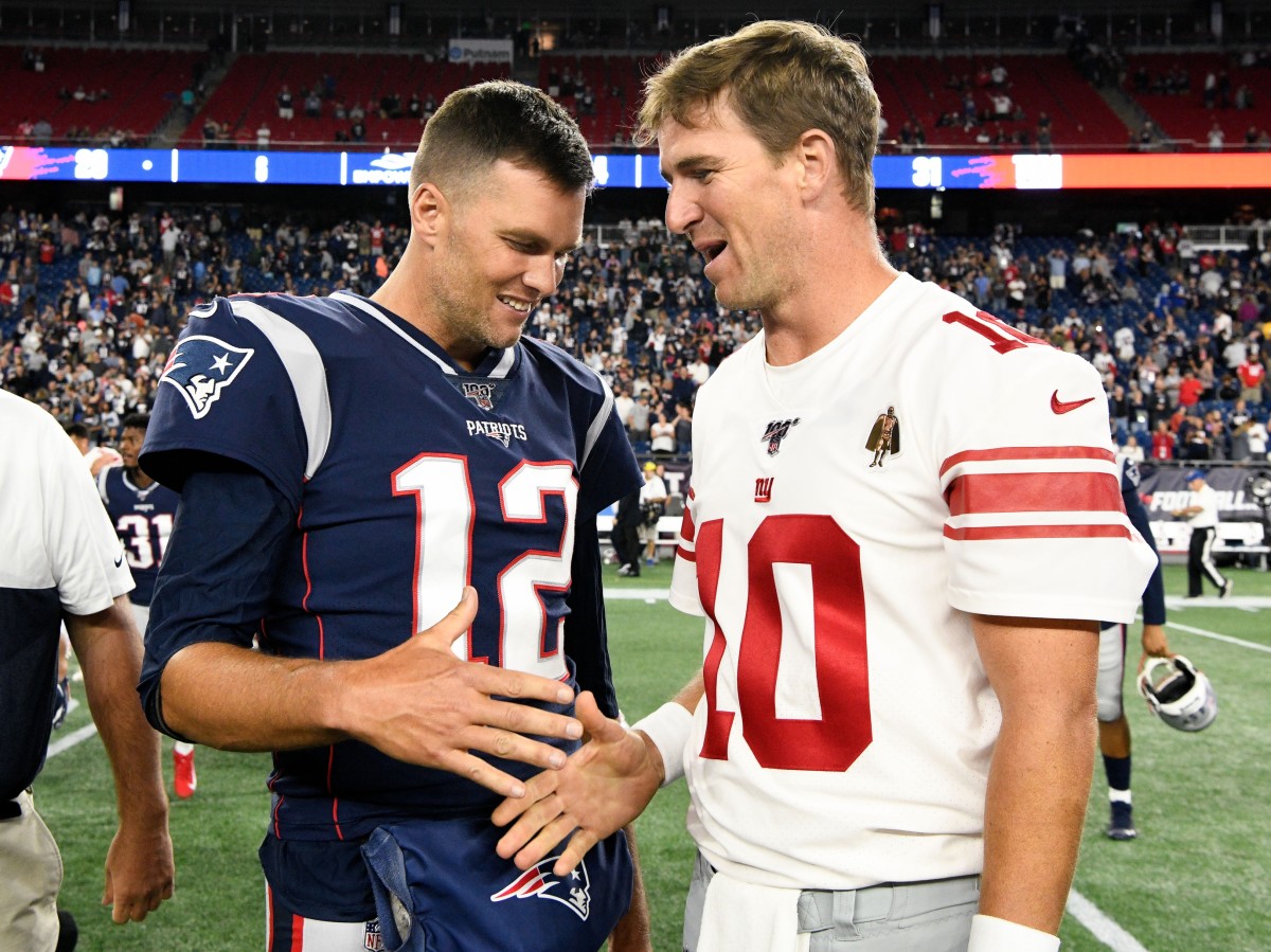 Aug 29, 2019; Foxborough, MA, USA; New England Patriots quarterback Tom Brady (12) and New York Giants quarterback Eli Manning (10) shake hands after a preseason game at Gillette Stadium.