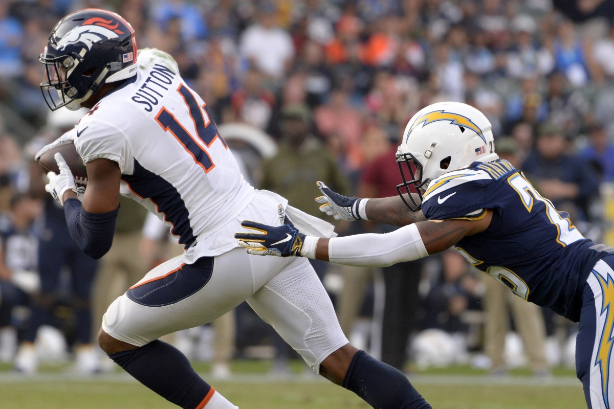 Denver Broncos wide receiver Courtland Sutton (14) catches a fourth quarter pass as Los Angeles Chargers cornerback Casey Hayward (26) defends at StubHub Center.