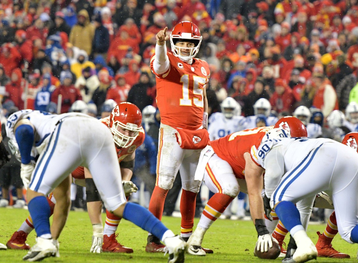 Jan 12, 2019; Kansas City, MO, USA; Kansas City Chiefs quarterback Patrick Mahomes (15) motions at the line of scrimmage against the Indianapolis Colts in an AFC Divisional playoff football game at Arrowhead Stadium.
