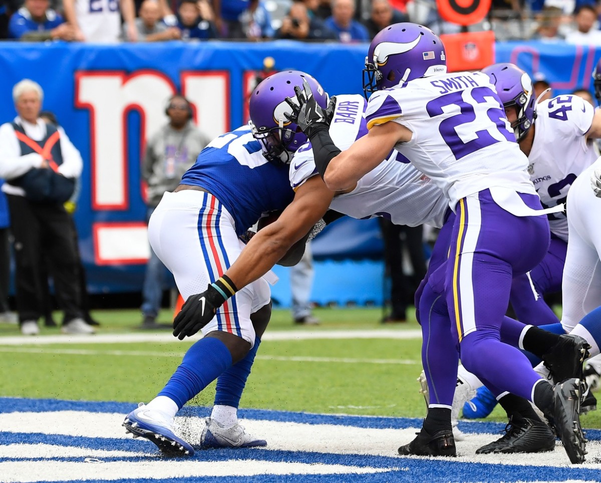 Oct 6, 2019; East Rutherford, NJ, USA; Minnesota Vikings outside linebacker Anthony Barr (55) tackles New York Giants running back Jon Hilliman (28) for a safety in the 1st half at MetLife Stadium.