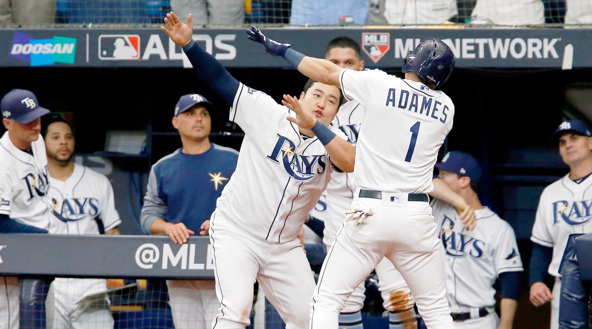 Oct 7, 2019; St. Petersburg, FL, USA; Tampa Bay Rays shortstop Willy Adames (1) celebrates his home run against the Houston Astros with first baseman Ji-Man Choi (26) during the sixth inning in game three of the 2019 ALDS playoff baseball series at Tropicana Field. Mandatory Credit: Reinhold Matay-USA TODAY Sports