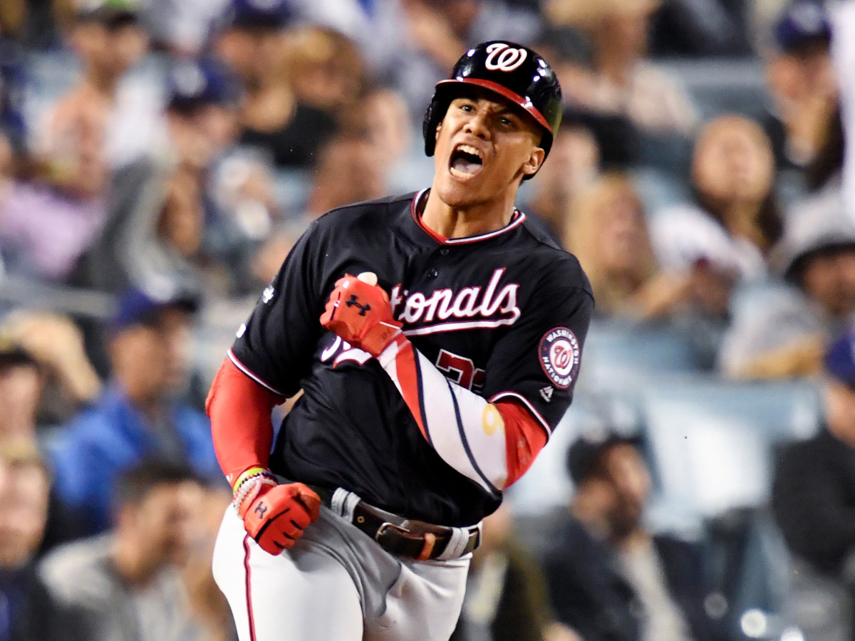 Oct 9, 2019; Los Angeles, CA, USA; Washington Nationals left fielder Juan Soto (22) celebrates after a solo home run during the eighth inning in game five of the 2019 NLDS playoff baseball series against the Los Angeles Dodgers at Dodger Stadium. Mandatory Credit: Robert Hanashiro-USA TODAY Sports