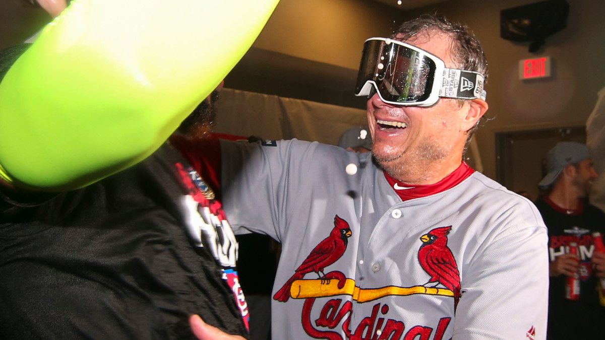 Cardinals manager Mike Shildt celebrates in the locker room.