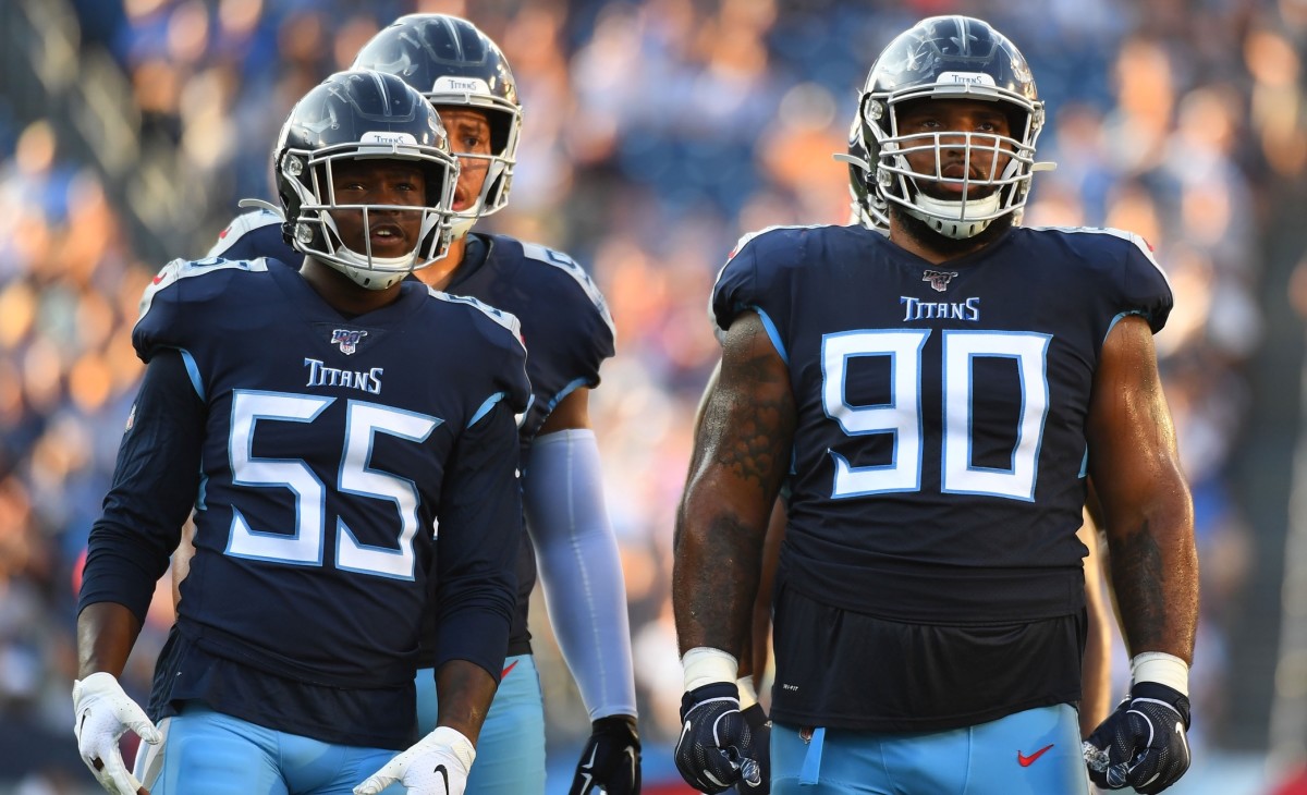 Tennessee Titans inside linebacker Jayon Brown (55) and Tennessee Titans defensive end DaQuan Jones (90) wait at the line during the first half against the New England Patriots at Nissan Stadium.