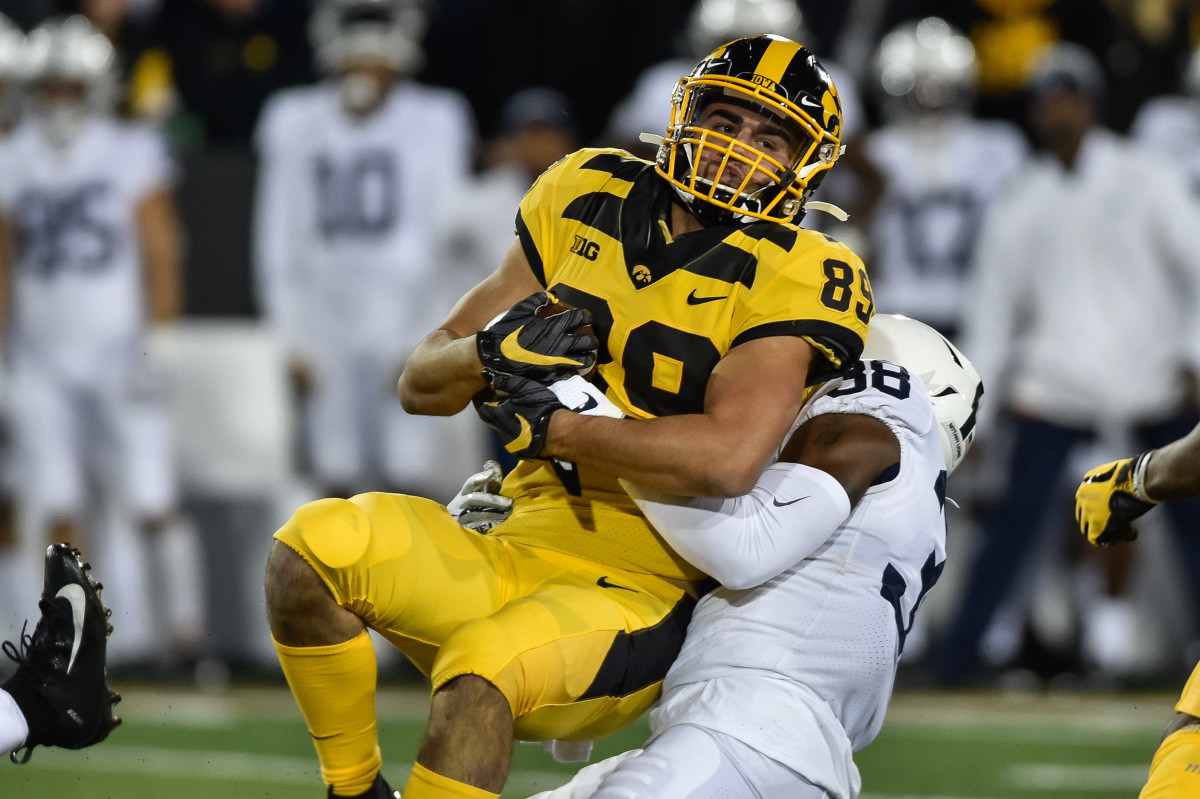 Iowa's Nico Ragaini is tackled by Penn State's Lamont Wade in Saturday's game.