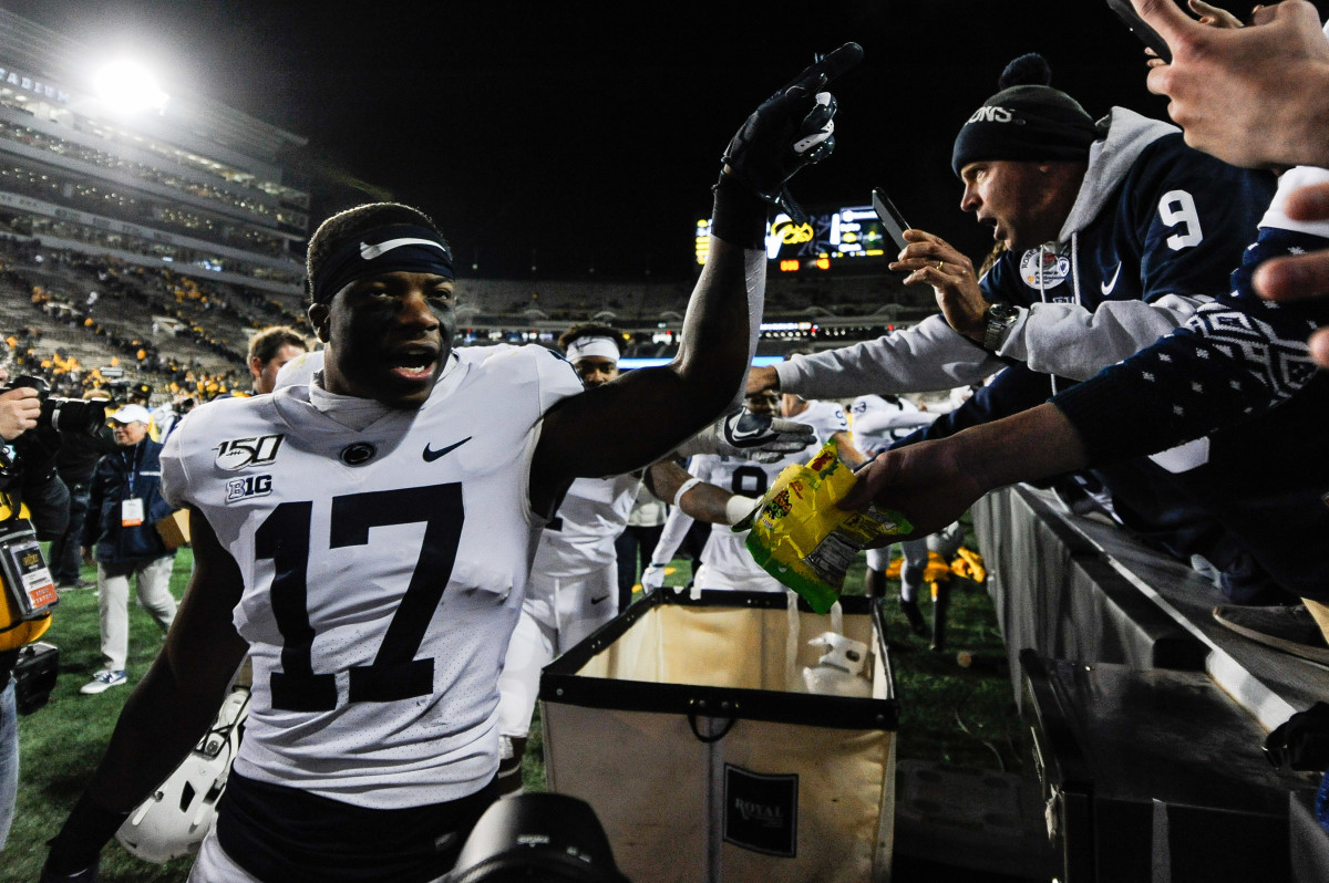 Penn State safety Garrett Taylor (17) celebrates with fans after Saturday's 17-12 win at Iowa.