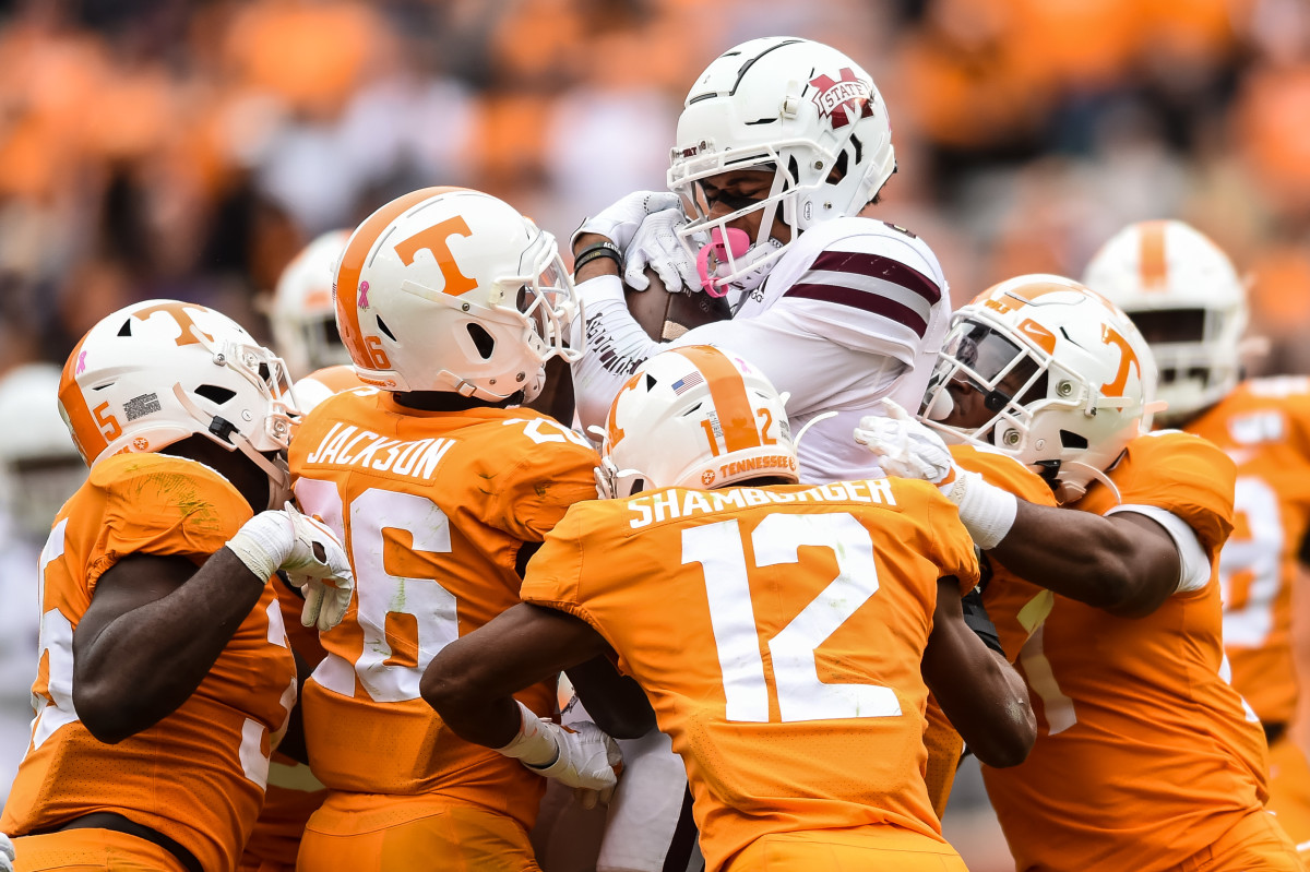 Oct 12, 2019; Knoxville, TN, USA; Tennessee Volunteers defensive back Shawn Shamburger (12) and defensive back Terrell Bailey (36) and defensive back Shawn Shamburger (12) and linebacker Daniel Bituli (35) and others gang tackle Mississippi State Bulldogs wide receiver Osirus Mitchell (5) in the fourth quarter at Neyland Stadium. Mandatory Credit: Bryan Lynn-USA TODAY Sports