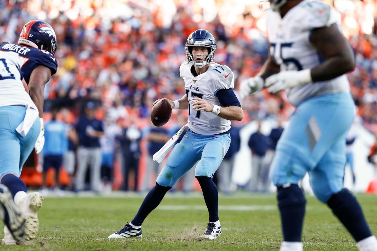 Tennessee Titans quarterback Ryan Tannehill (17) looks to pass in the fourth quarter against the Denver Broncos at Empower Field at Mile High.