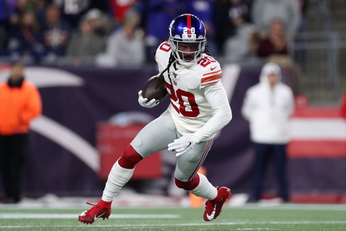 Oct 10, 2019; Foxborough, MA, USA; New York Giants cornerback Janoris Jenkins (20) runs with the ball after intercepting a pass from the New England Patriots during the first half at Gillette Stadium.