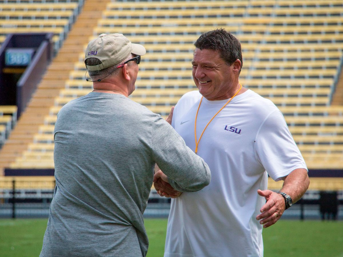 Lousiana Gov. John Bel Edwards and Ed Orgeron during an LSU spring practice