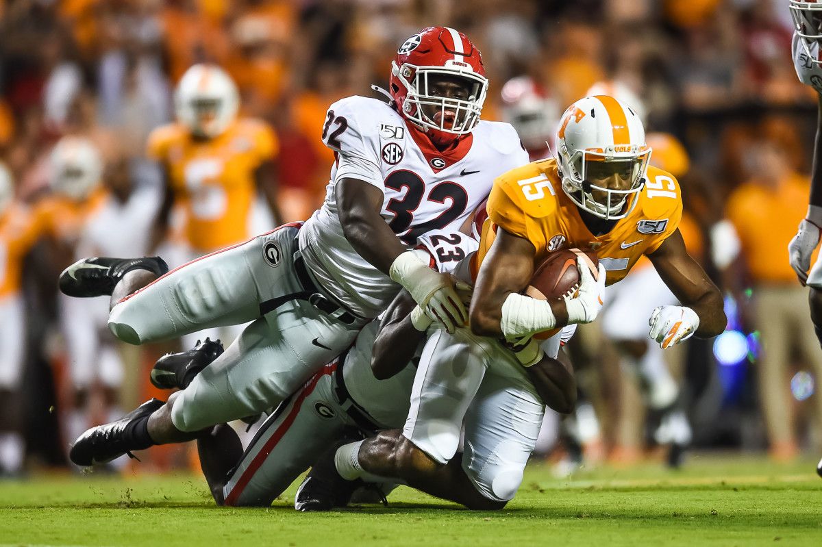 Monty Rice making a tackle against Tennessee.