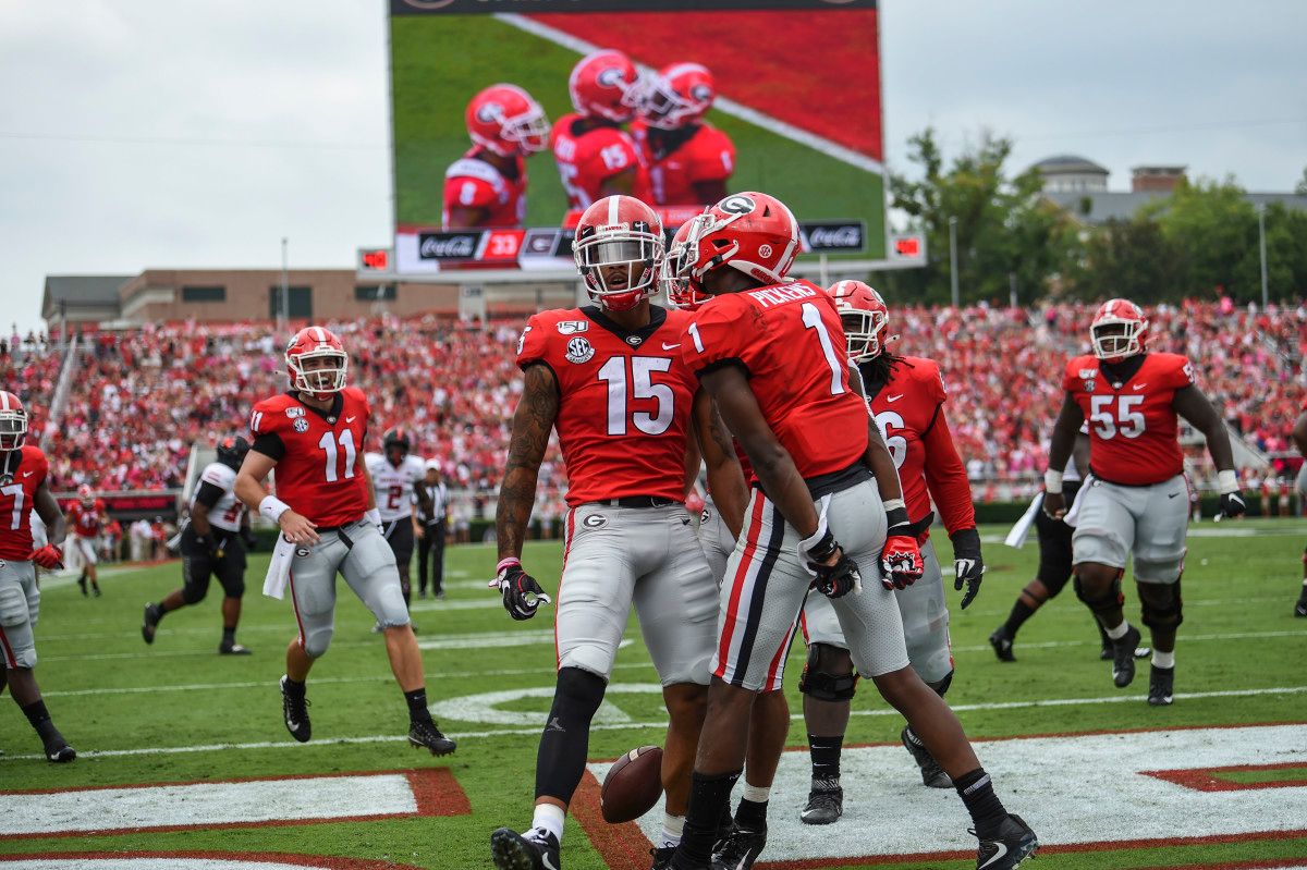 Lawrence Cager celebrating a touchdown against Arkansas State.