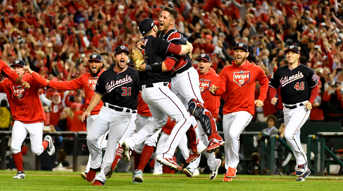 Oct 15, 2019; Washington, DC, USA; Washington Nationals catcher Yan Gomes (10) hugs relief pitcher Daniel Hudson (44) as they celebrate their win over the St. Louis Cardinals in game four of the 2019 NLCS playoff baseball series at Nationals Park. Mandatory Credit: Brad Mills-USA TODAY Sports
