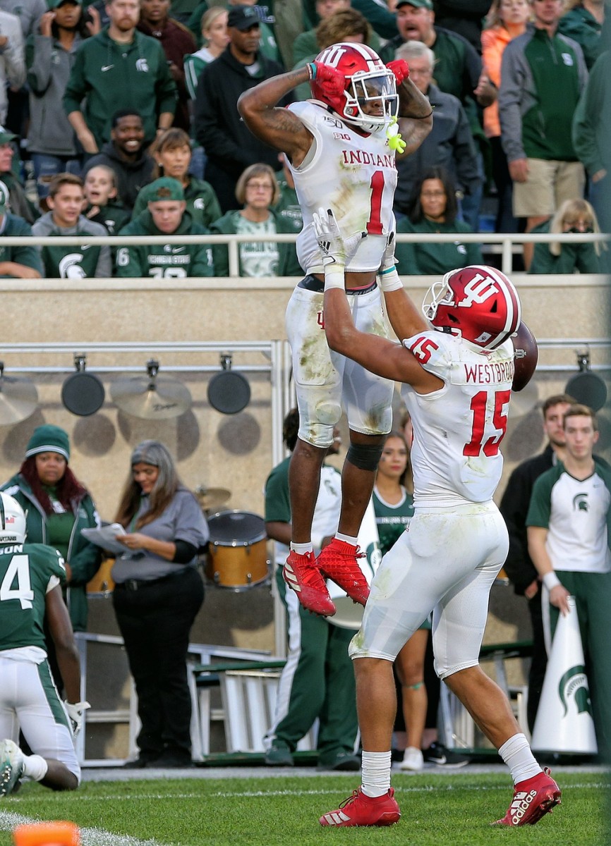 East Lansing, MI, USA; Indiana Hoosiers wide receiver Nick Westbrook (15) and wide receiver Whop Philyor (1) celebrate a touchdown during the second half of a game against the Michigan State Spartans at Spartan Stadium. Mandatory Credit: Mike Carter-USA TODAY Sports