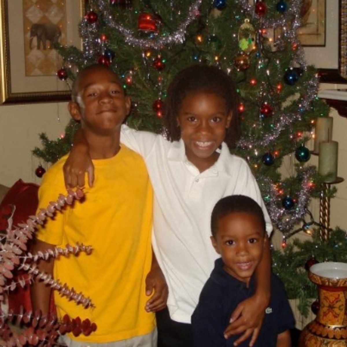 Whop Philyor and his two sisters at Christmas.(Photo courtesy of Holley Mouling)