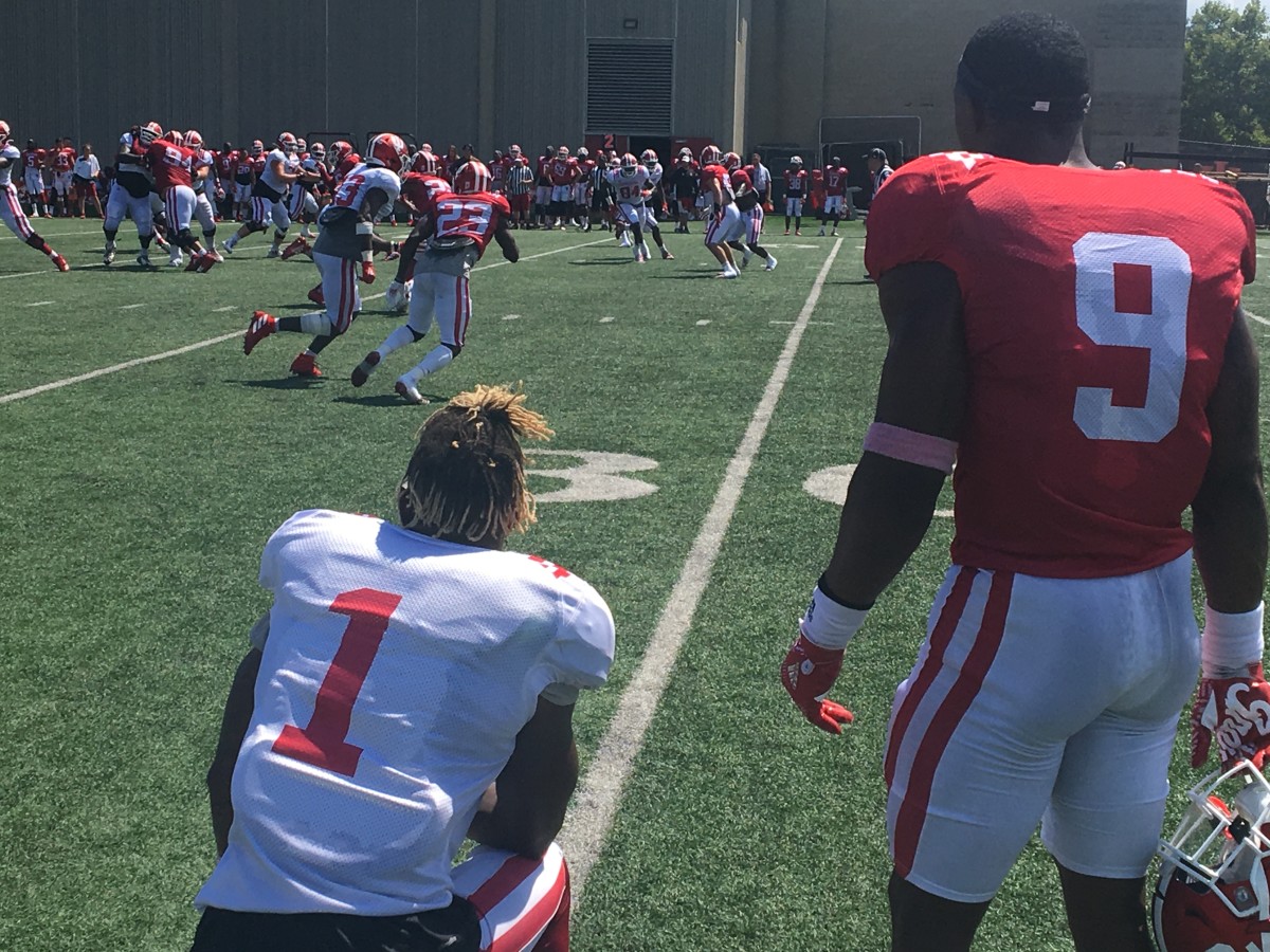 Whop Philyor (left) watches a fall camp practice  with Marcelino Ball.