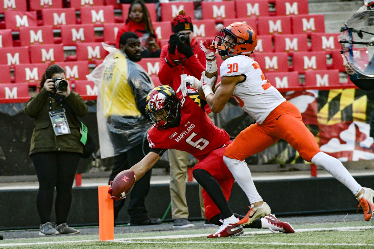 Maryland wide receiver Jeshaun Jones (6) reaches for a touchdown as Illinois defensive back Sydney Brown (30) defends during the third quarter of a 2018 game at Capital One Field at Maryland Stadium.