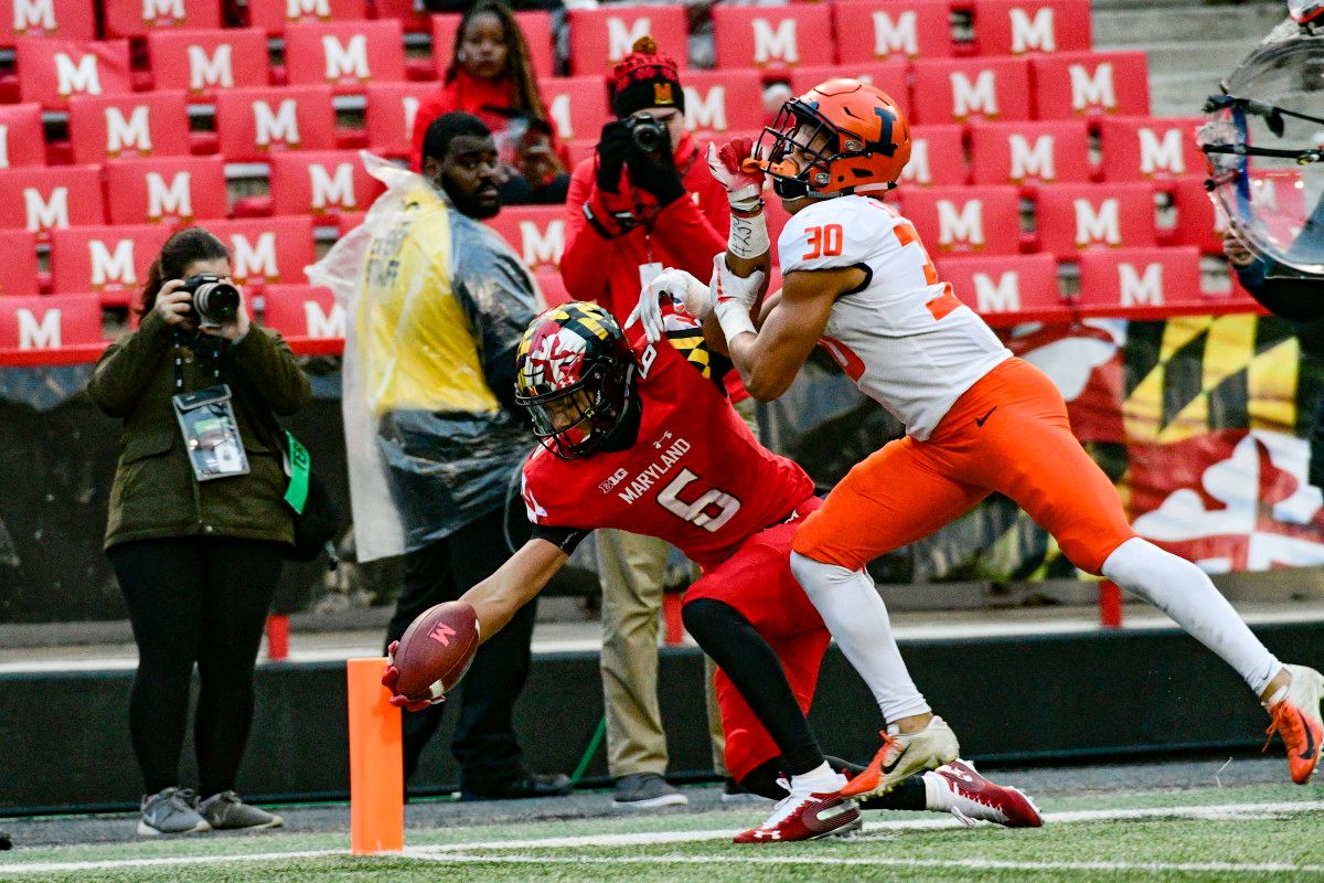 Maryland wide receiver Jeshaun Jones (6) reaches for a touchdown as Illinois defensive back Sydney Brown (30) defends during the third quarter of a 2018 game at Capital One Field at Maryland Stadium.