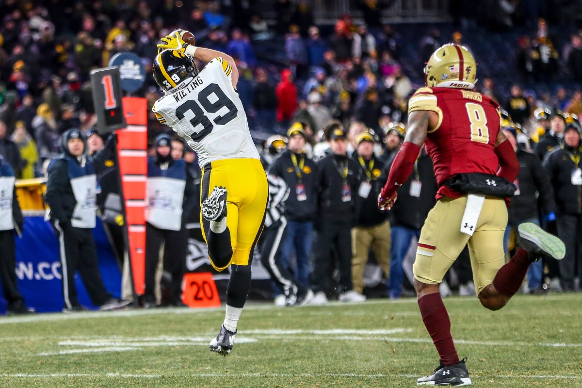Iowa tight end Nate Wieting (39) catches a pass in front of Boston College defensive back Will Harris during the second half of the 2017 Pinstripe Bowl at Yankee Stadium. It was the first reception of Wieting's career.