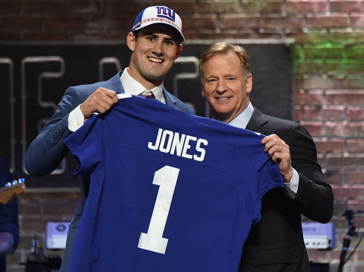 Apr 25, 2019; Nashville, TN, USA; Daniel Jones (Duke) is selected as the number six overall pick to the New York Giants and poses for a photo with NFL commissioner Roger Goodell during the 2019 NFL Draft in Downtown Nashville.