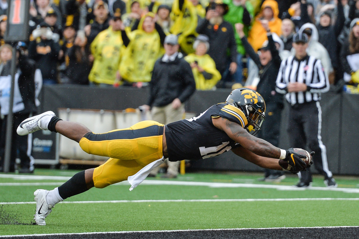 Iowa running back Mekhi Sargent leaps into the end zone for a fourth-quarter touchdown in Saturday's game against Purdue.