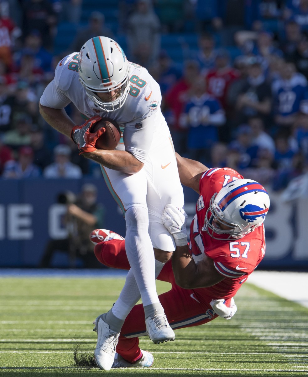 Mike Gesicki makes one of four catches against the Bills.