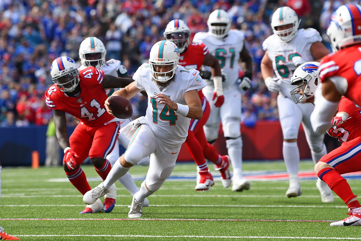 Oct 20, 2019; Orchard Park, NY, USA; Miami Dolphins quarterback Ryan Fitzpatrick (14) runs with the ball against the Buffalo Bills during the third quarter at New Era Field. Mandatory Credit: Rich Barnes-USA TODAY Sports