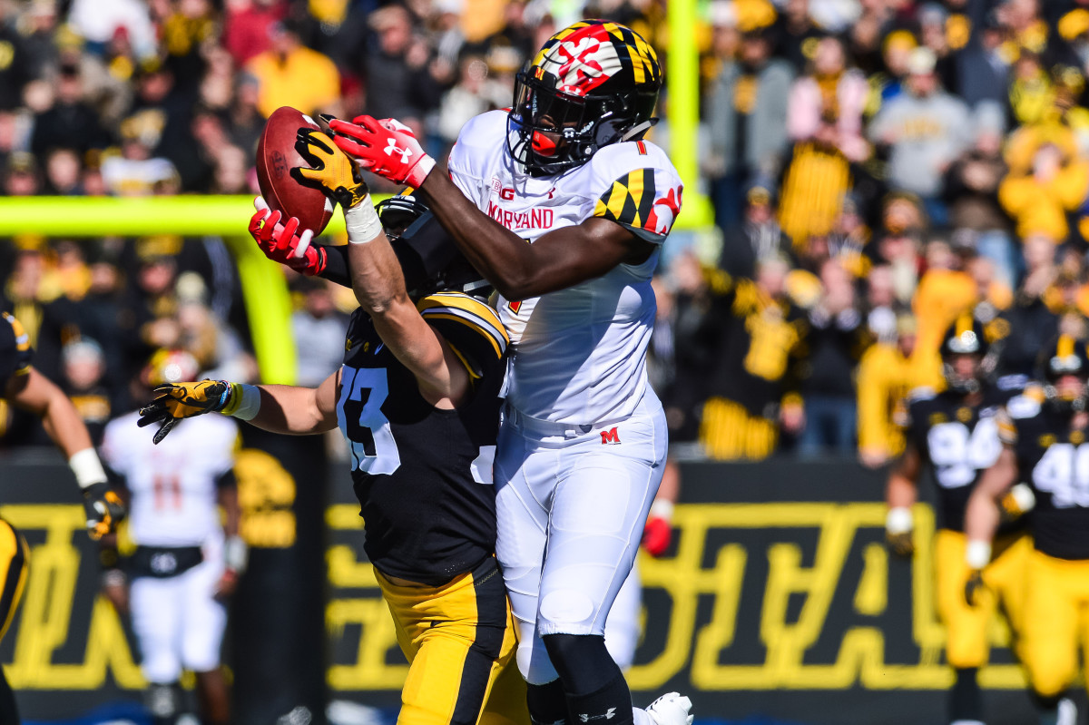 Iowa's Riley Moss (left) breaks up a pass intended for Maryland's Dontay Demus in last season's game.