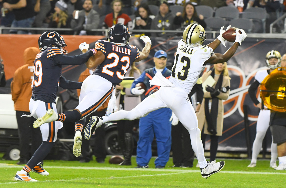Oct 20, 2019; Chicago, IL, USA; New Orleans Saints wide receiver Michael Thomas (13) makes a catch against Chicago Bears cornerback Kyle Fuller (23) during the second half at Soldier Field. Mandatory Credit: Mike DiNovo-USA TODAY Sports