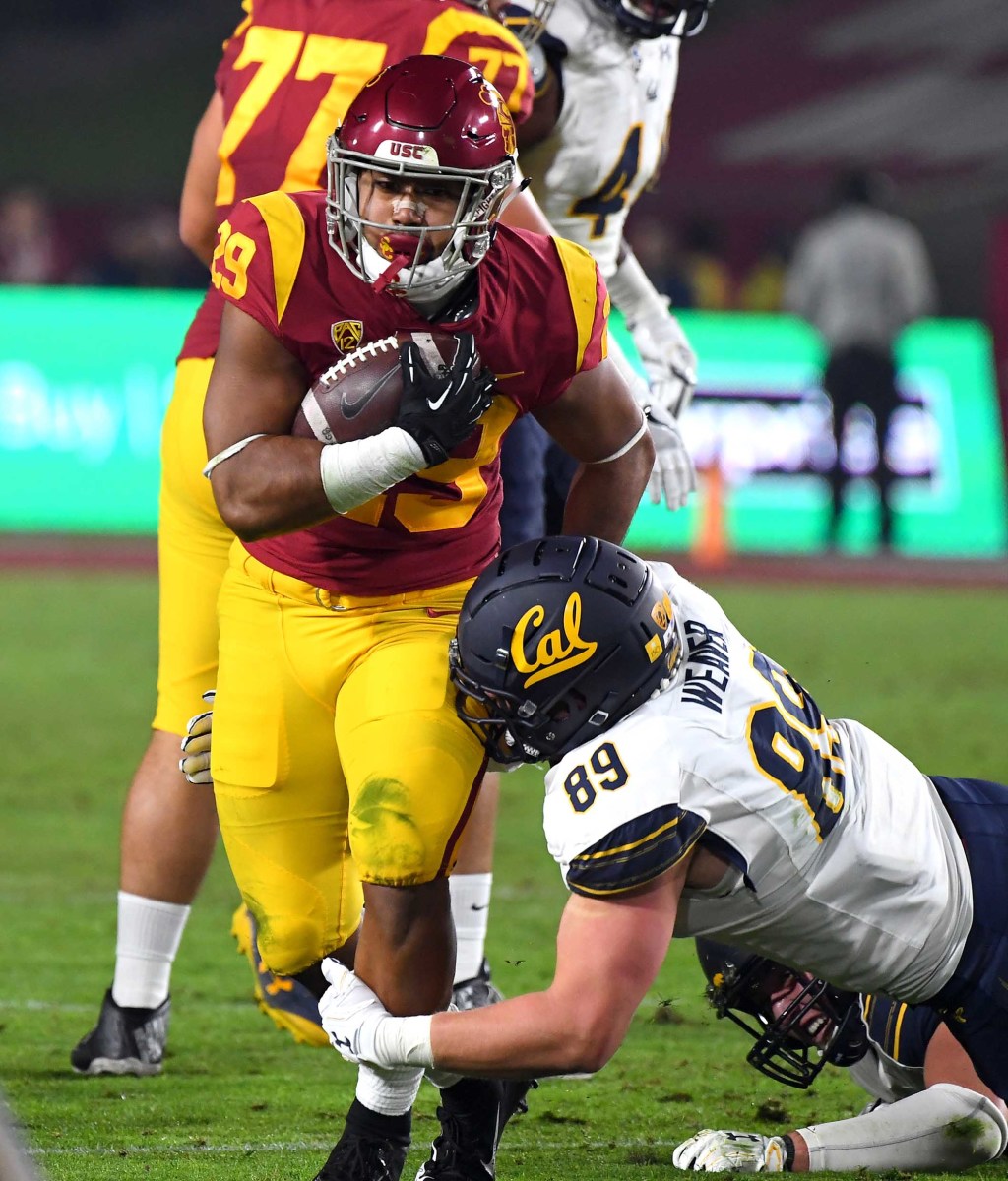 Nov 10, 2018; Los Angeles, CA, USA; USC Trojans running back Vavae Malepeai (29) runs for a short game before he is stopped by California Golden Bears linebacker Evan Weaver (89) in the first quarter of the game at the Los Angeles Memorial Coliseum. Mandatory Credit: Jayne Kamin-Oncea-USA TODAY Sports