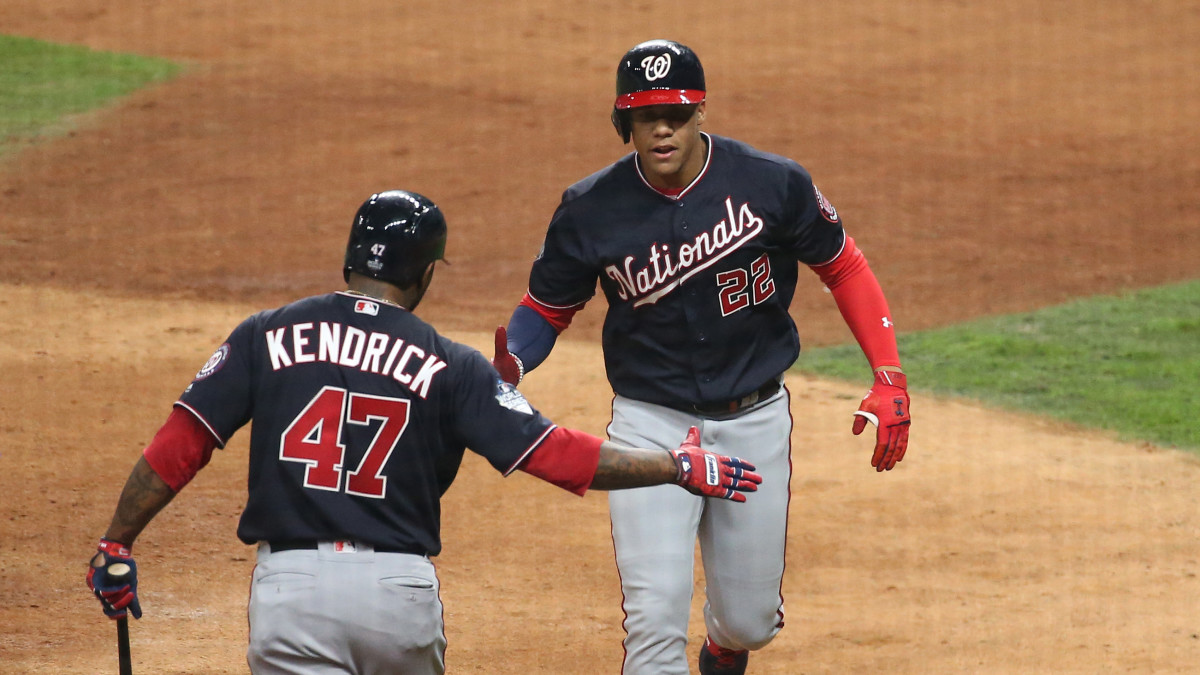 Oct 22, 2019; Houston, TX, USA; Washington Nationals left fielder Juan Soto (22) celebrates with second baseman Howie Kendrick (47) after hitting a home run against the Houston Astros during the fourth inning of game one of the 2019 World Series at Minute Maid Park. Mandatory Credit: Troy Taormina-USA TODAY Sports