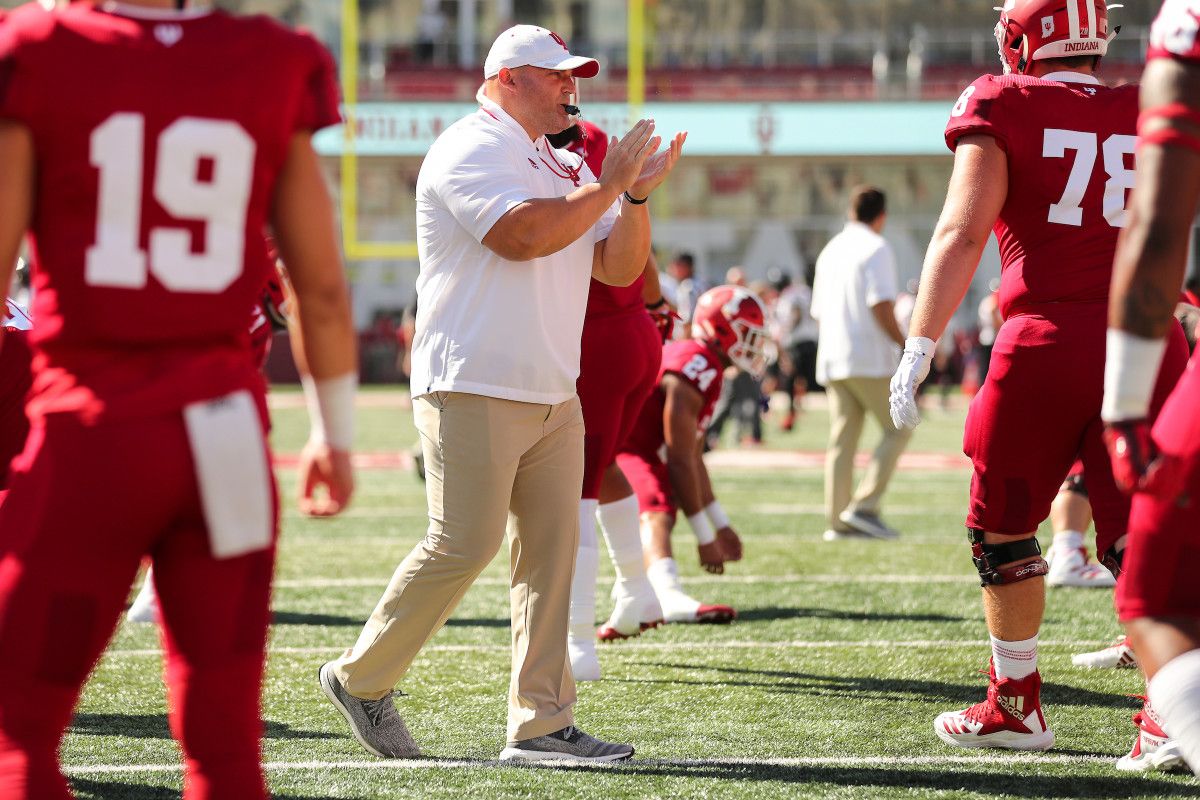 Indiana Director of Athletic Performance David Ballou claps as he gets his players stretched and ready to play a game at Memorial Stadium. (Photos courtesy of Indiana Athletics)