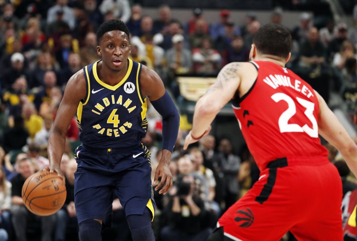 Indiana Pacers guard Victor Oladipo (4) is guarded by Toronto Raptors guard Fred VanVleet (23) during the first quarter at Bankers Life Fieldhouse. Mandatory Credit: Brian Spurlock-USA TODAY Sports