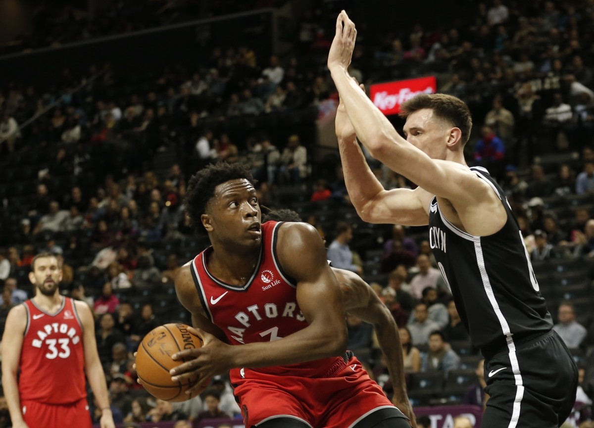 Brooklyn, NY, USA; Toronto Raptors forward OG Anunoby (3) moves the ball against Brooklyn Nets forward Rodions Kurucs (00) in the second quarter at Barclays Center. Mandatory Credit: Nicole Sweet-USA TODAY Sports