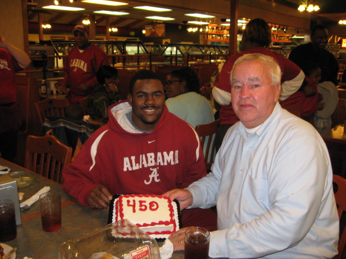 Tommy Ray with Mark Ingram Jr. when his streak of attending Alabama game reached No. 450