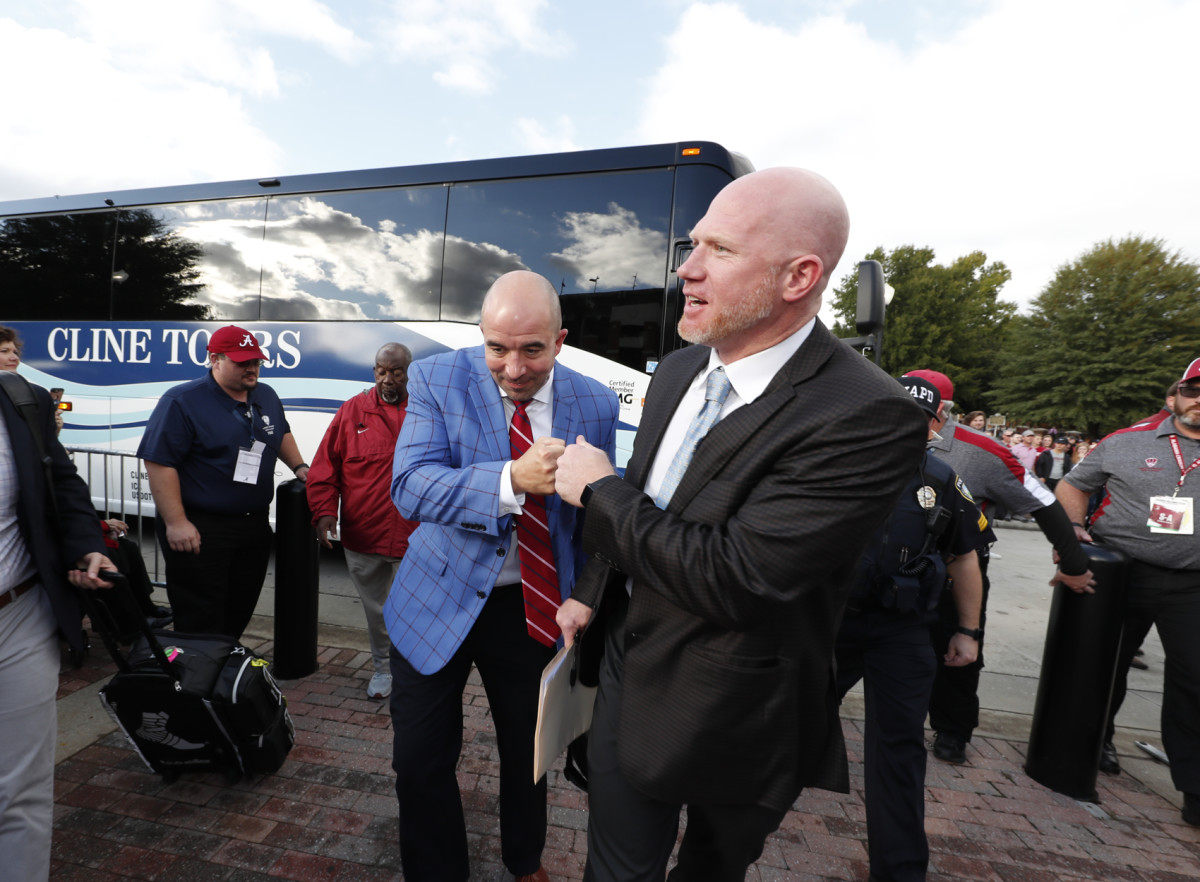 Scott Cochran and Jeff Allen get off the bus before an Alabama home game