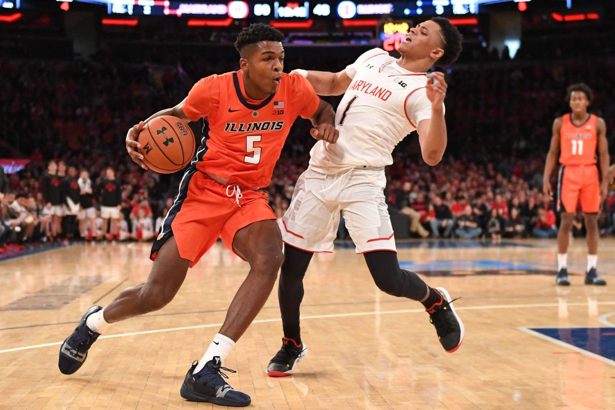 Illinois guard Tevian Jones (5) gets called for a charge on Maryland Terrapins guard Anthony Cowan Jr. (1) during the second half at Madison Square Garden.