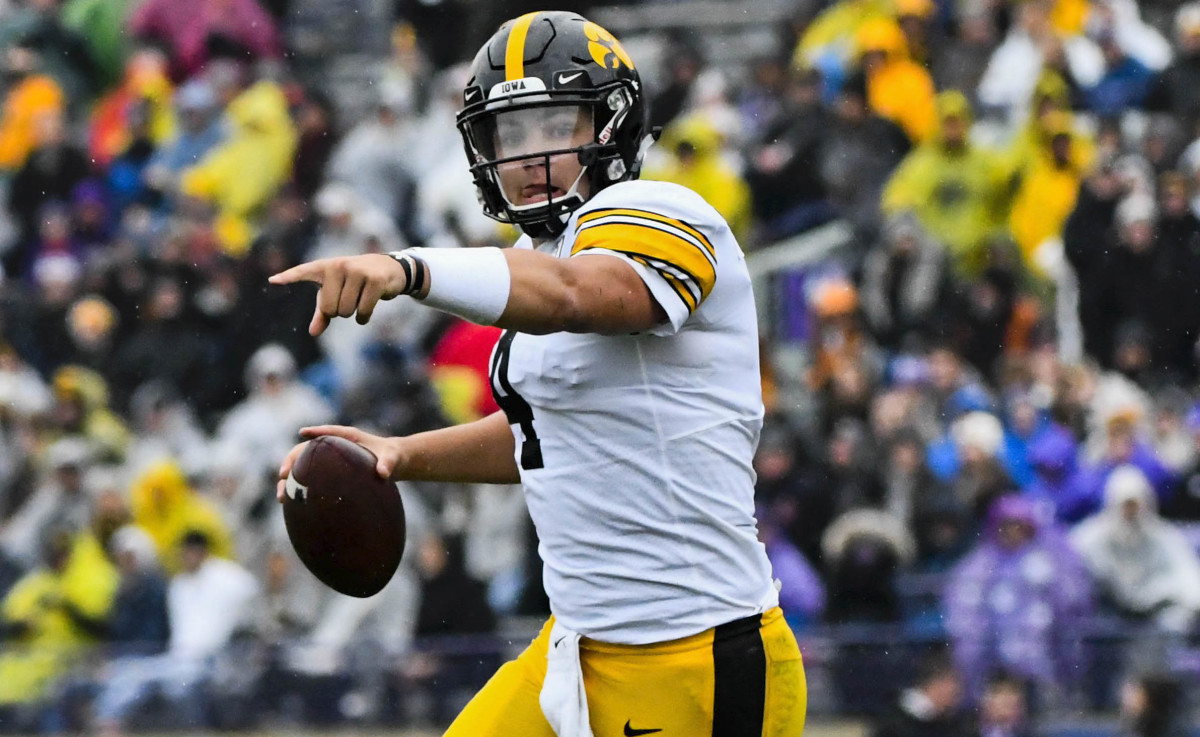 Iowa quarterback Nate Stanley directs a receiver during Saturday's game at Northwestern.