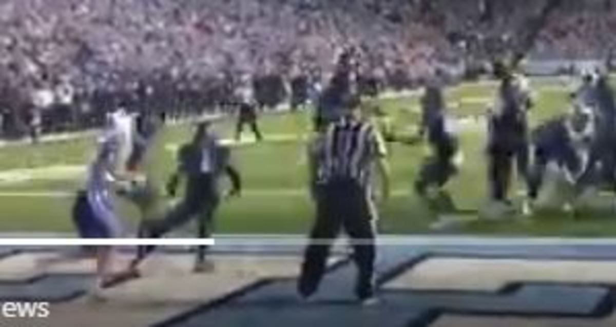 Left, two UNC defenders stand in front of Gray in the end zone.
