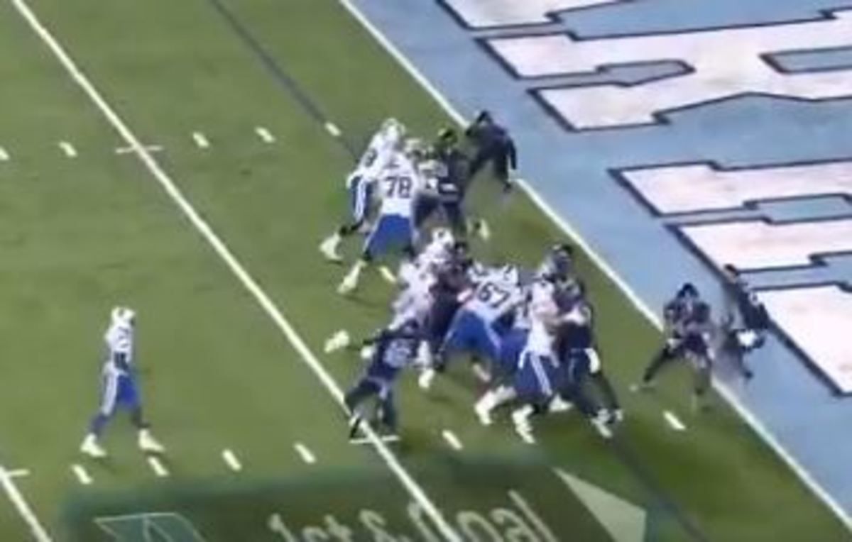 Surratt (far right) jumps at the goal line to catch the pass