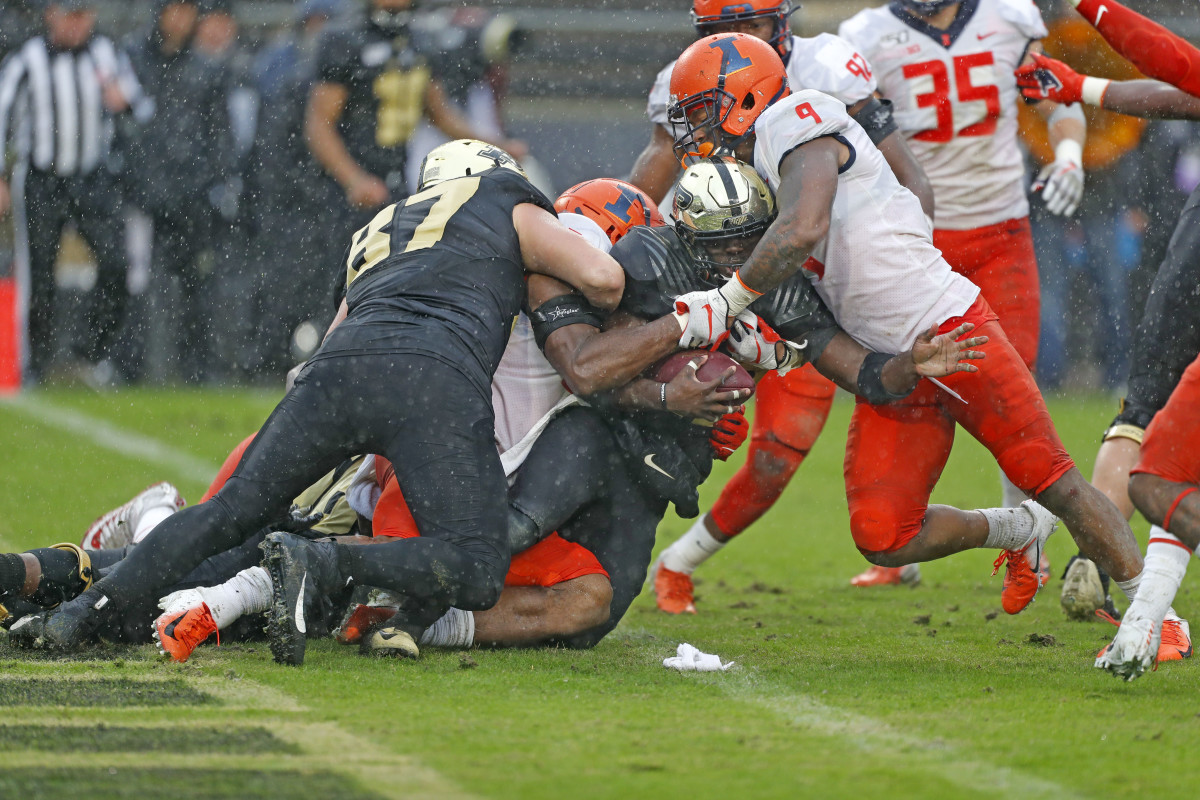 Purdue running back King Doerue (22) is stopped inside their own 1 yard line by Illinois linebacker Dele Harding (9) during the fourth quarter at Ross-Ade Stadium.