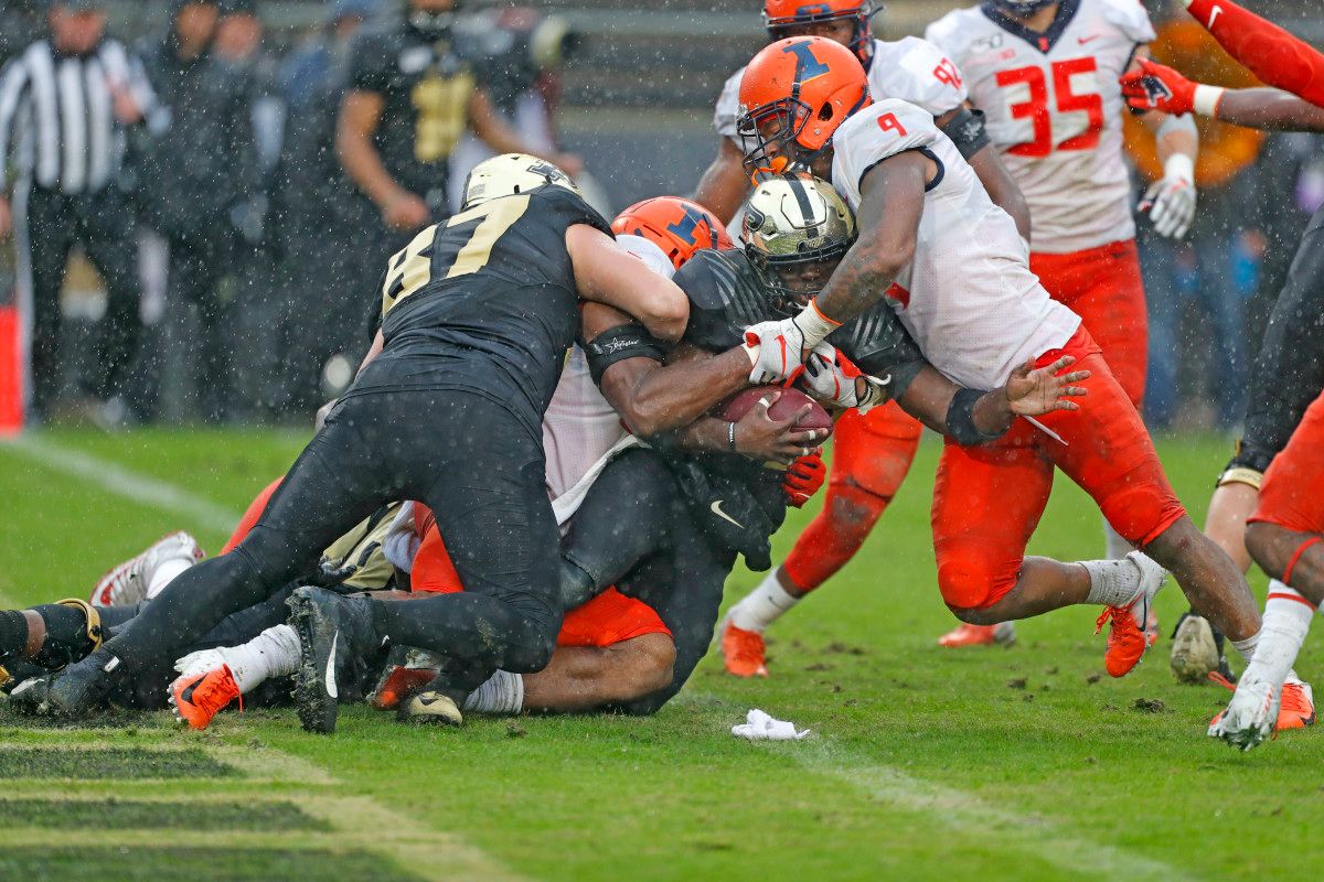 Purdue running back King Doerue (22) is stopped inside their own 1 yard line by Illinois linebacker Dele Harding (9) during the fourth quarter at Ross-Ade Stadium.