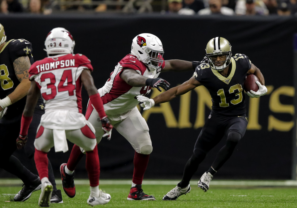 Oct 27, 2019; New Orleans, LA, USA; New Orleans Saints wide receiver Michael Thomas (13) runs past Arizona Cardinals defensive tackle Rodney Gunter (95) during the fourth quarter at the Mercedes-Benz Superdome. Mandatory Credit: Derick E. Hingle-USA TODAY Sports