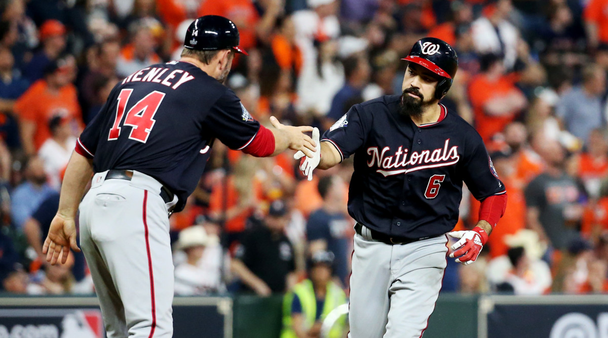 Oct 29, 2019; Houston, TX, USA; Washington Nationals third baseman Anthony Rendon (6) celebrates with third base coach Bob Henley (14) after hitting a two-run home run against the Houston Astros during the seventh inning in game six of the 2019 World Series at Minute Maid Park. Mandatory Credit: Troy Taormina-USA TODAY Sports