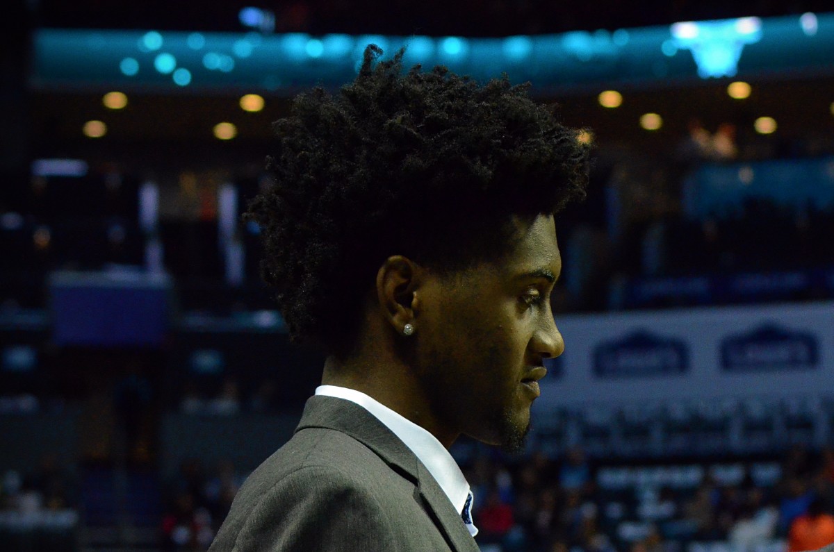 Jalen McDaniels hangs out courtside before the Charlotte Hornets' season opener against the Chicago Bulls on Oct. 23, 2019. (Mitchell Northam / Hornet Maven - Sports Illustrated)